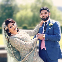 Asian bride and groom posing together