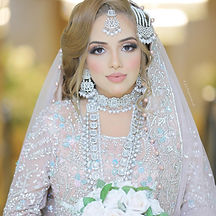 Asian Bride holding flower bouquet on her wedding